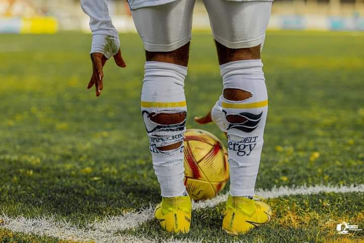 Why Footballers Put Holes in Their Socks: An In-Depth Look